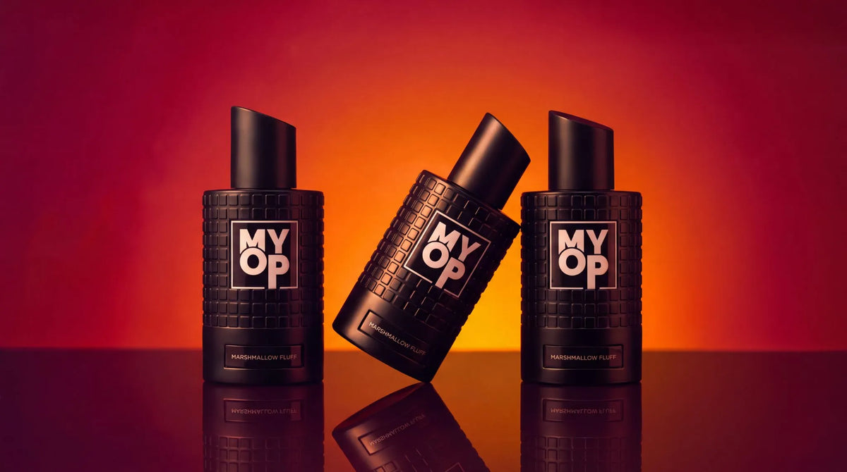 New black MYOP perfume bottle held in hand