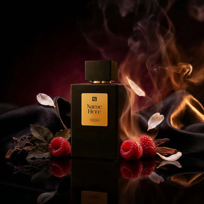 Black perfume bottle with gold label surrounded by raspberries and leaves on a dark background